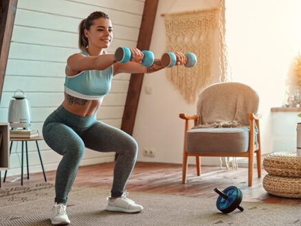 Working Out at Home A young woman does her fitness workout at home